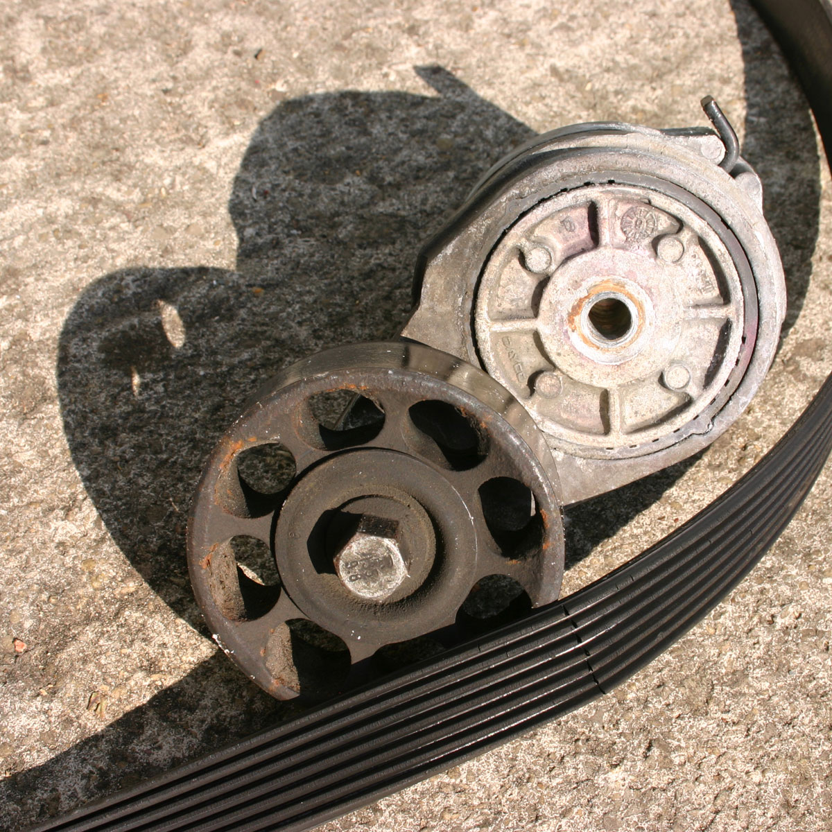 Drive belt tensioner replacement costs repairs AutoGuru